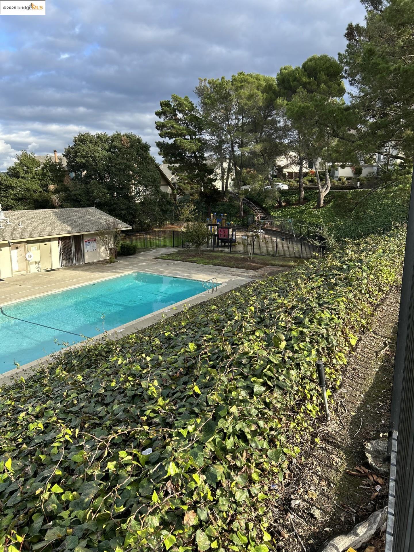 1363 Ridgecrest Road Pinole, CA 94564 - Photo 4 of 37 a view of a yard with a house in the background