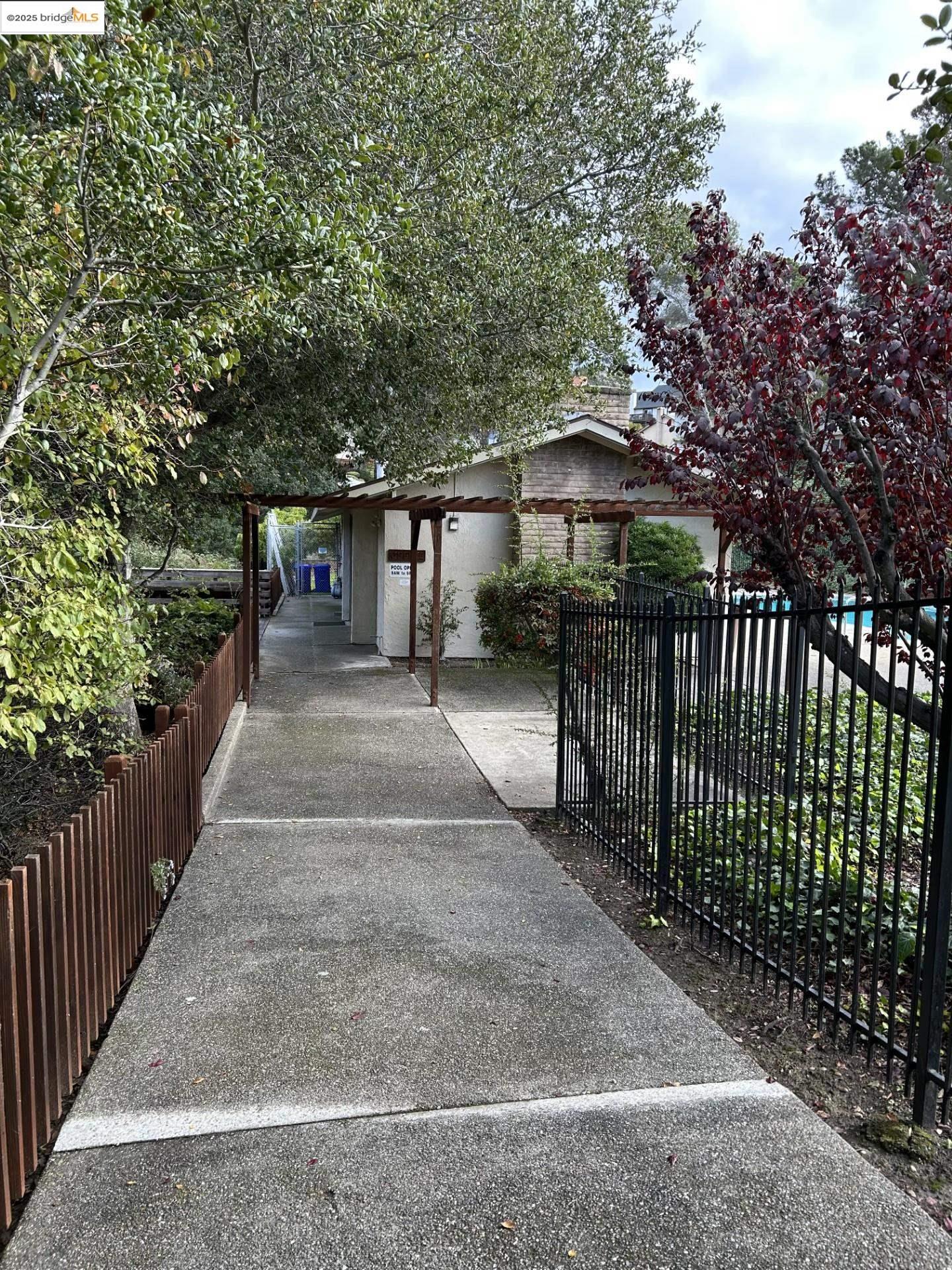 1363 Ridgecrest Road Pinole, CA 94564 - Photo 5 of 37 a front view of a house with a yard