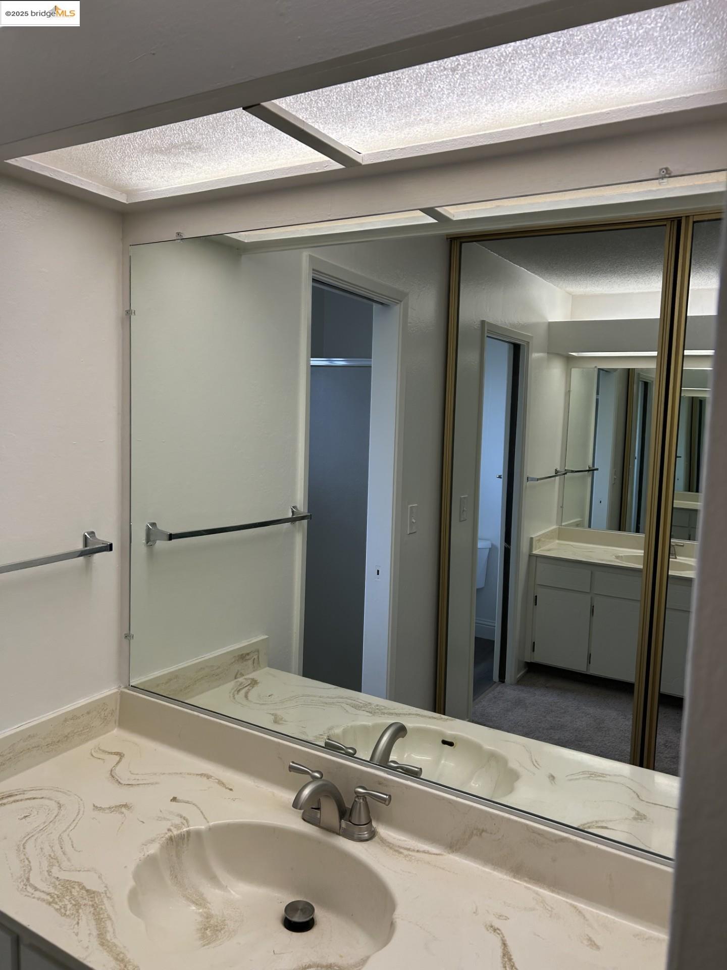 1363 Ridgecrest Road Pinole, CA 94564 - Photo 8 of 37 a bathroom with a sink and a mirror
