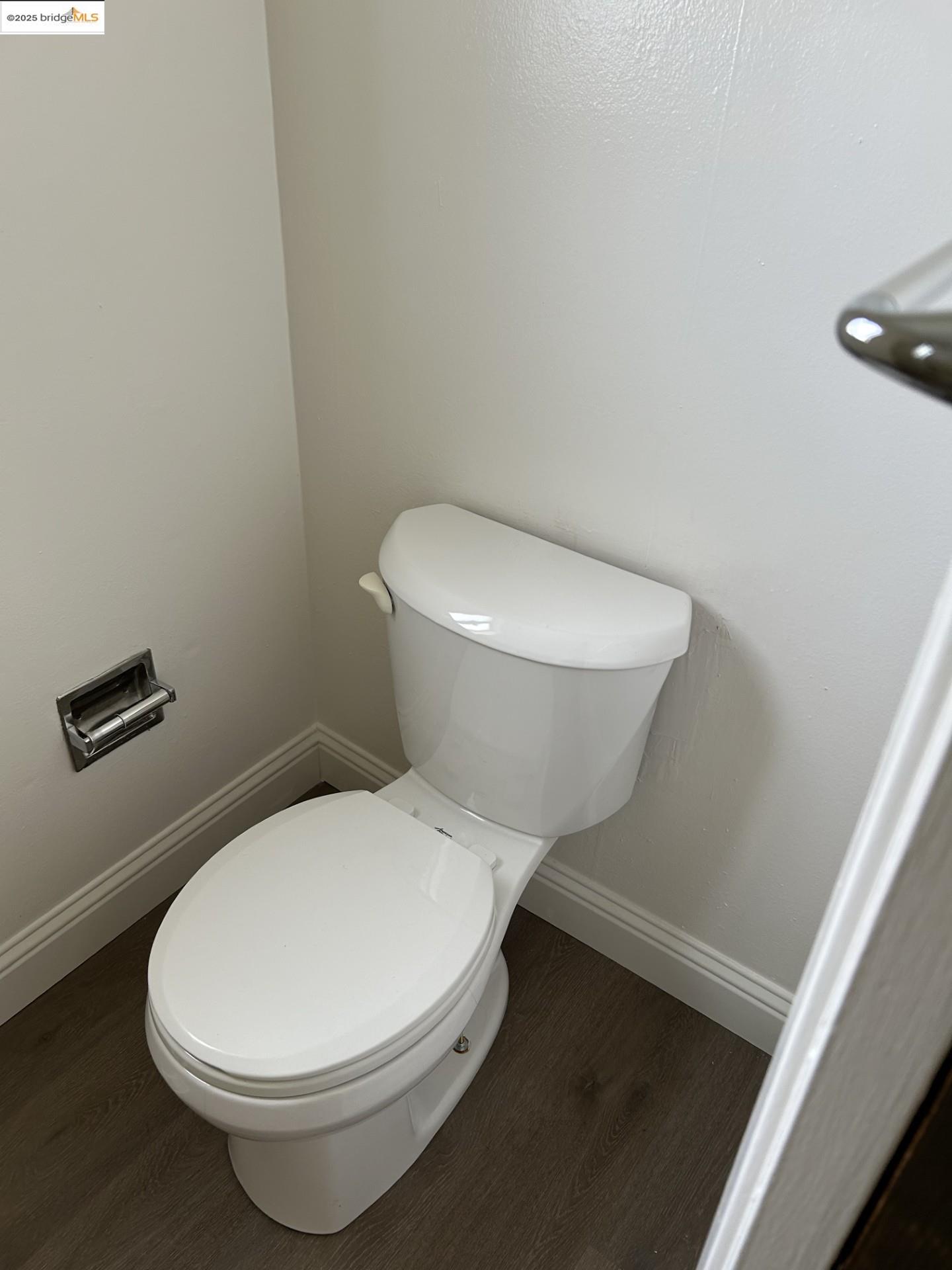 1363 Ridgecrest Road Pinole, CA 94564 - Photo 9 of 37 a white toilet sitting next to a white walls