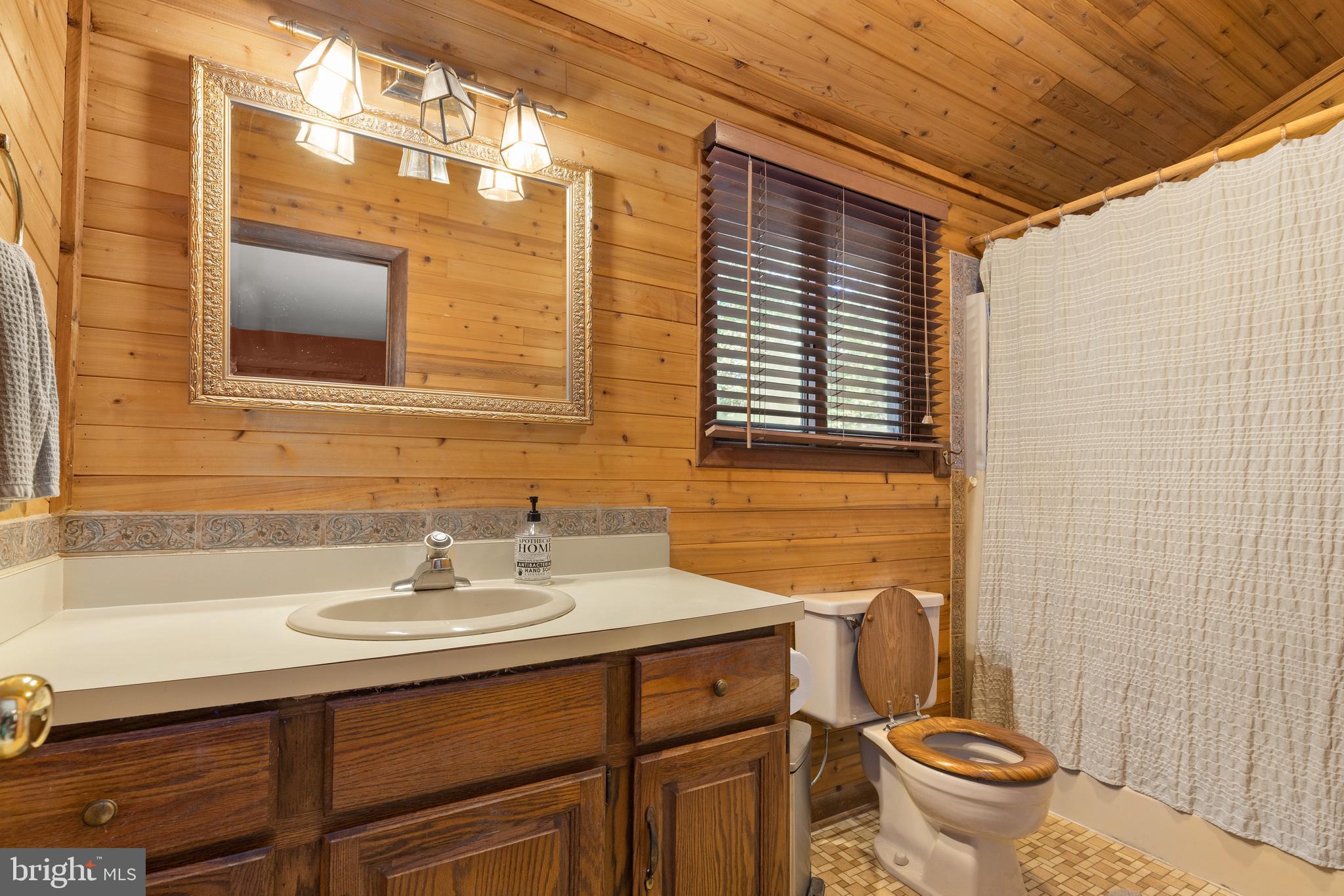 38 Canal Road Ocean Pines, MD 21811 - Photo 17 of 40 a bathroom with a sink toilet and shower