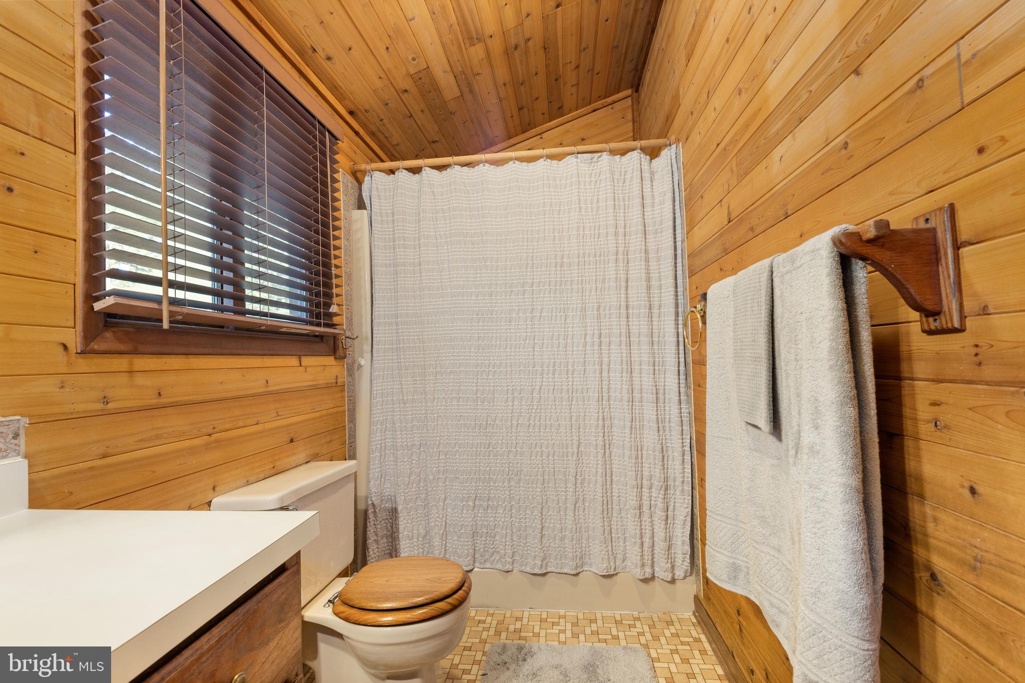 38 Canal Road Ocean Pines, MD 21811 - Photo 18 of 40 a bathroom with a toilet and a shower