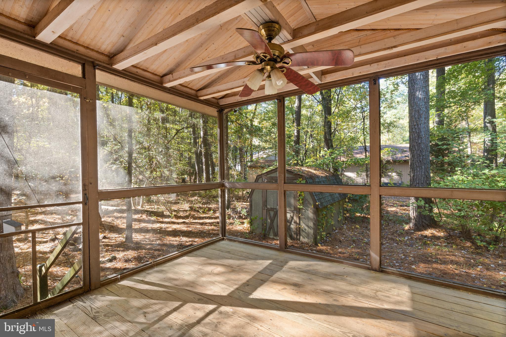 38 Canal Road Ocean Pines, MD 21811 - Photo 26 of 40 a view of a porch with a table and chairs