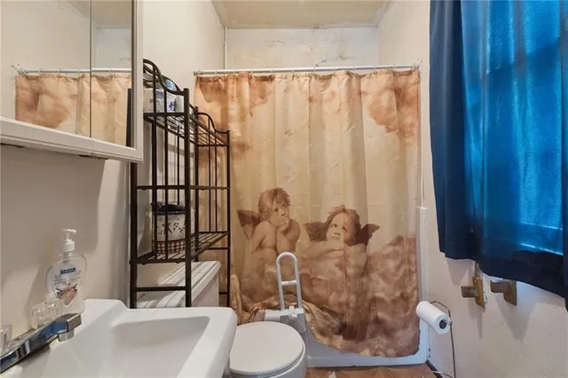 a view of a house with a patio and a yard