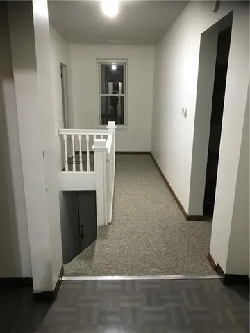 a view of a hallway with entryway