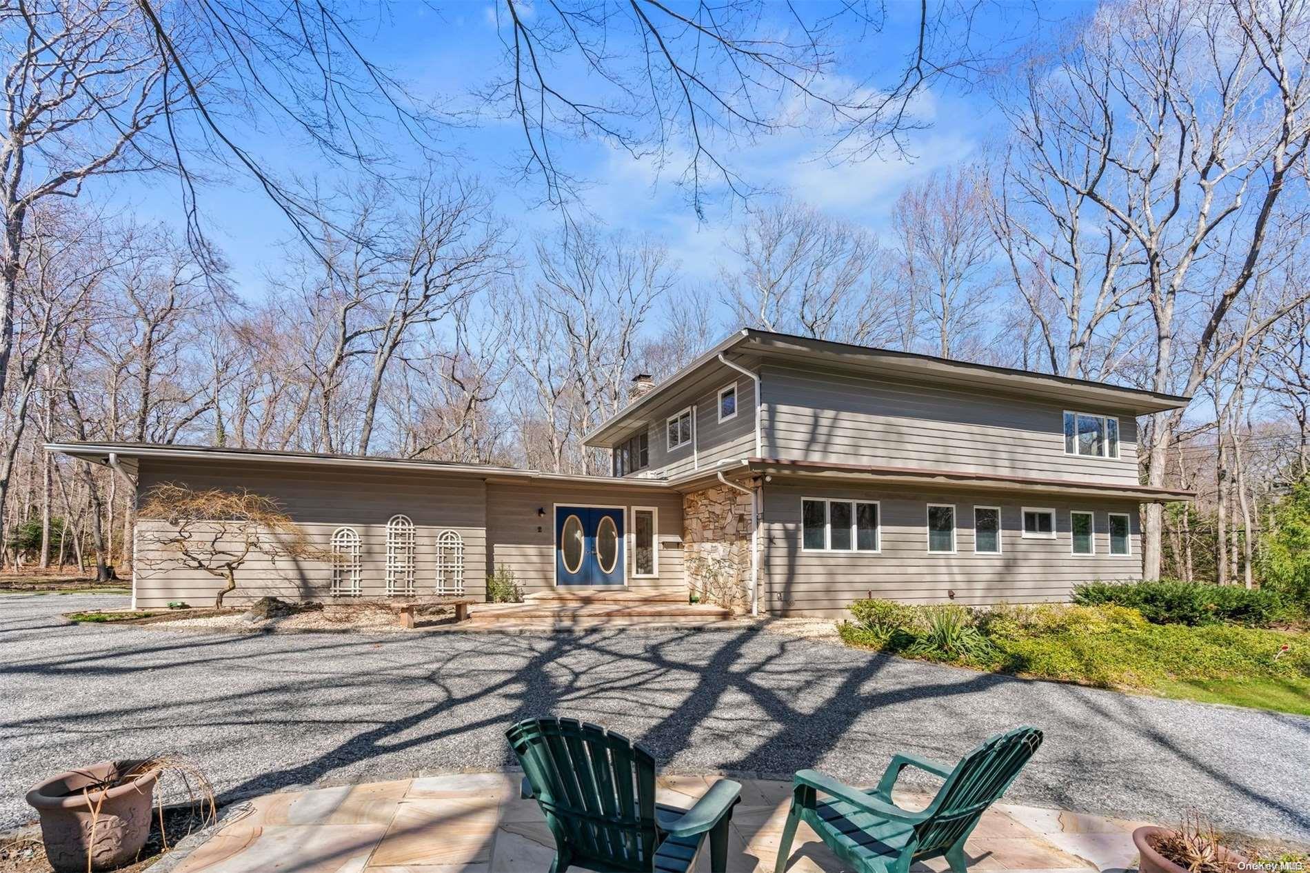 2 Wooded Court Lloyd Harbor, NY 11743 - Photo 1 of 1 front view of a house with a small yard
