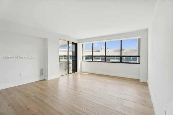a view of an empty room with a window