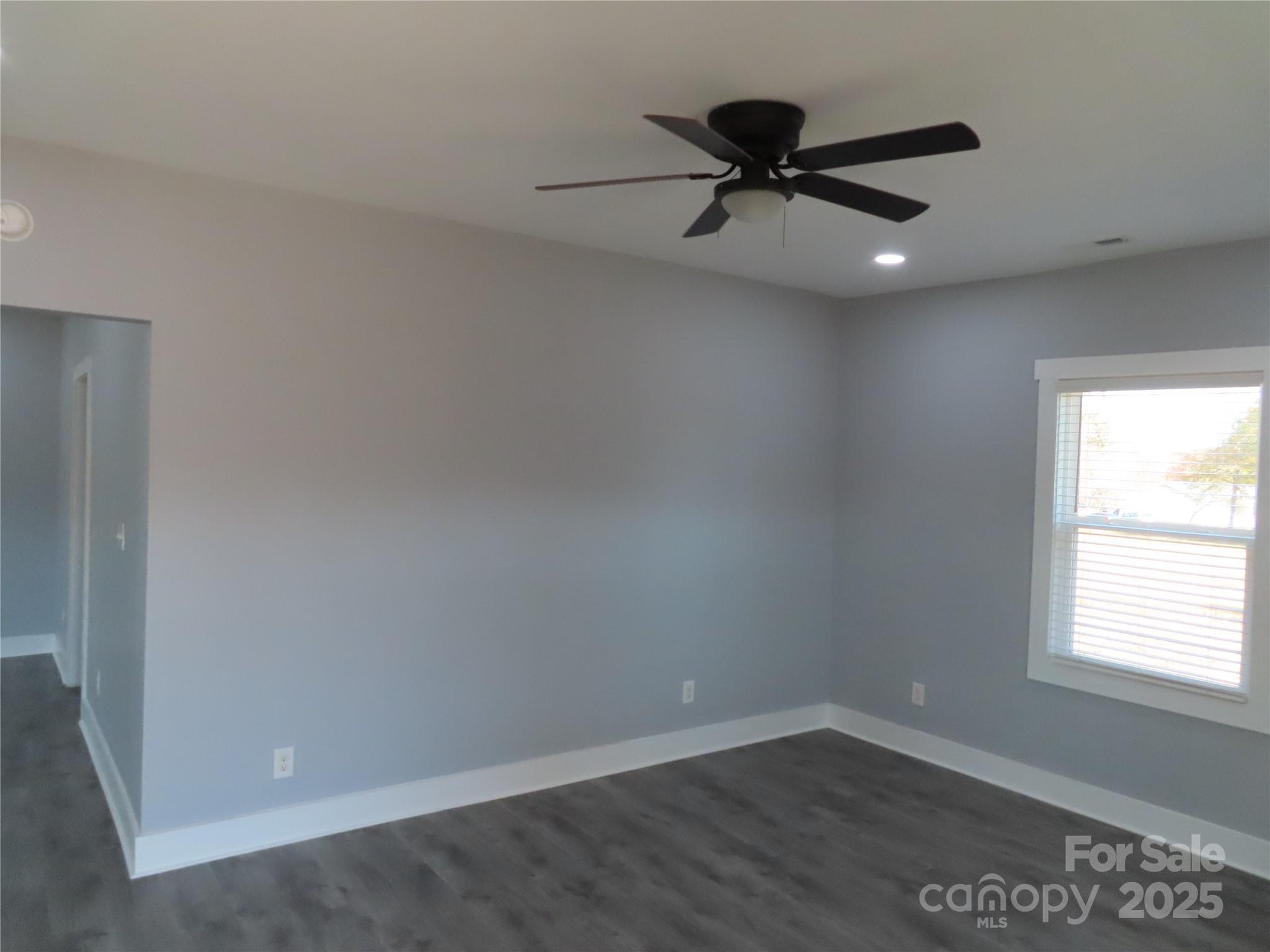 605 State Road 182 Chester, SC 29706 - Photo 13 of 32 an empty room with a ceiling fan and window