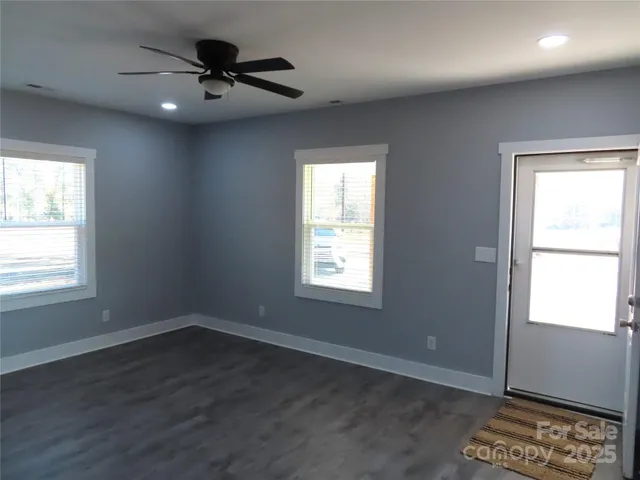 a view of an empty room with a window