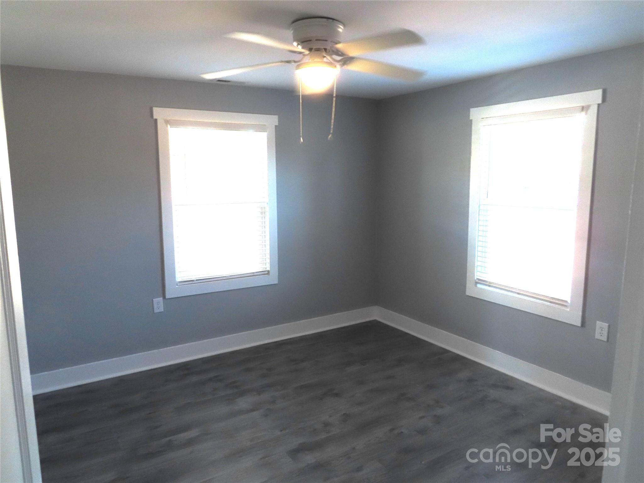 605 State Road 182 Chester, SC 29706 - Photo 29 of 32 an empty room with wooden floor windows and fan