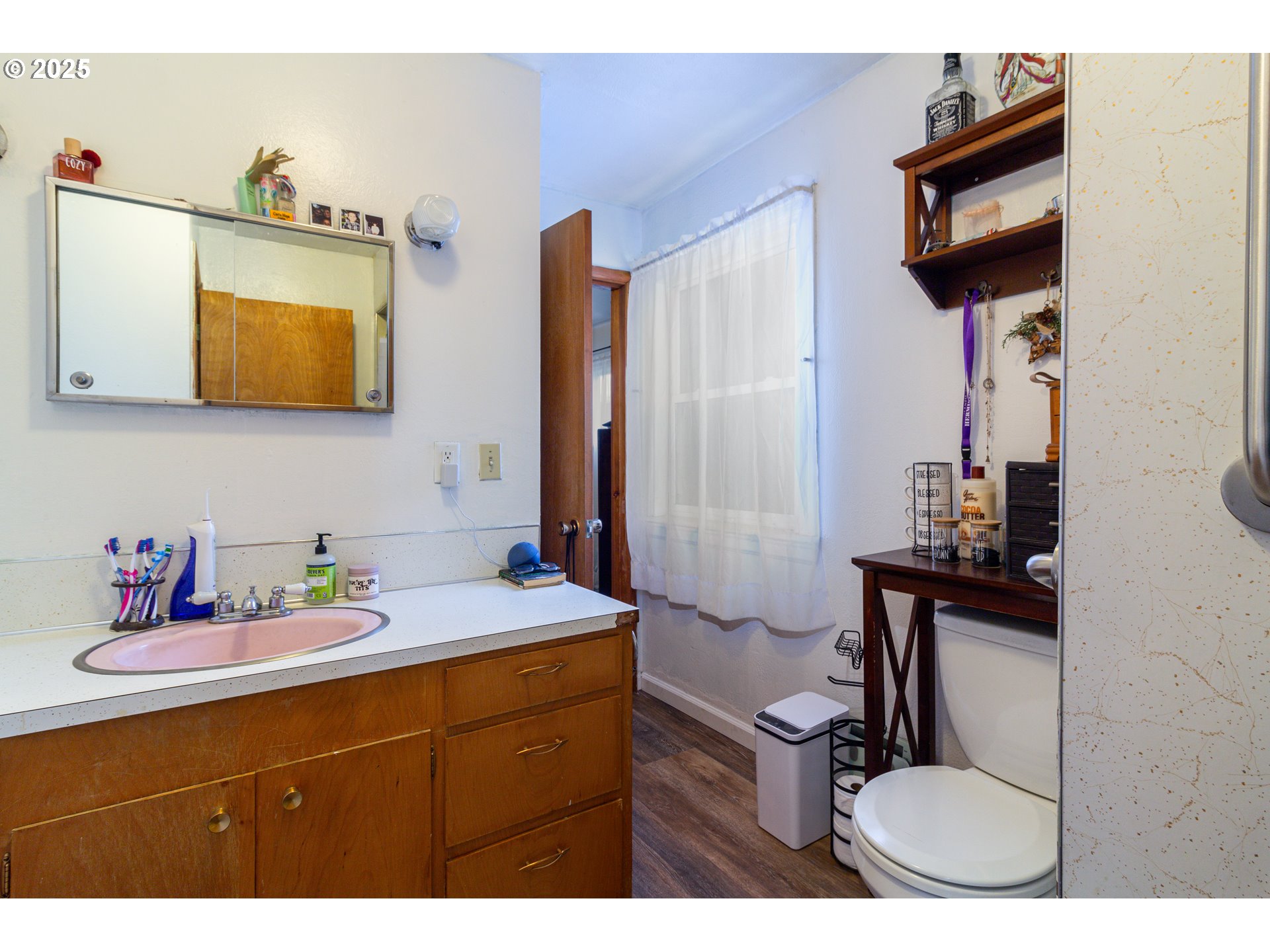 11 South Thielsen Street Echo, OR 97826 - Photo 12 of 14 a bathroom with a sink vanity mirror and toilet