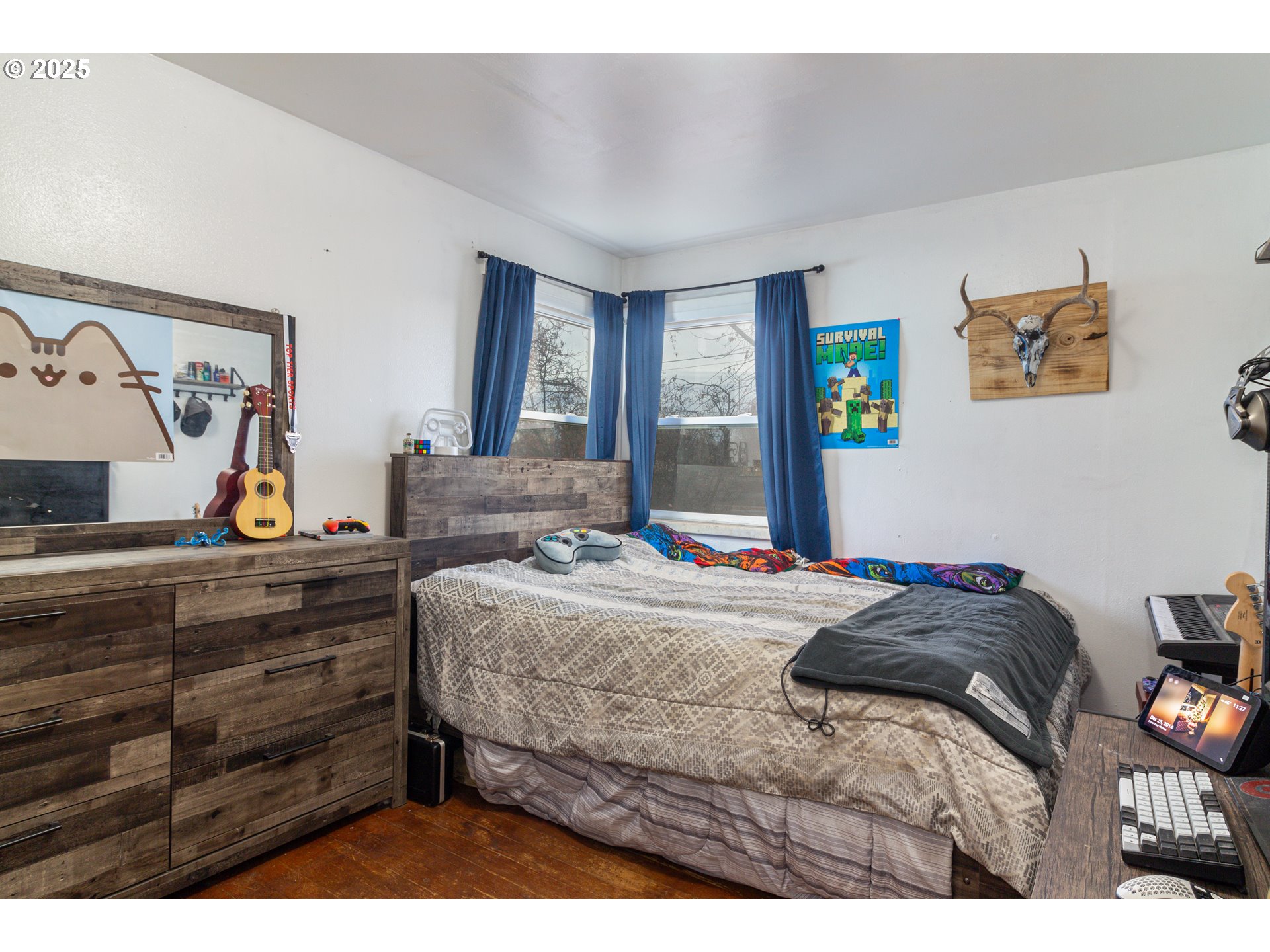 11 South Thielsen Street Echo, OR 97826 - Photo 14 of 14 a bedroom with a bed and painting on the wall