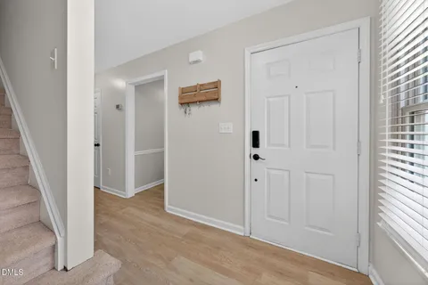 an empty room with wooden floor