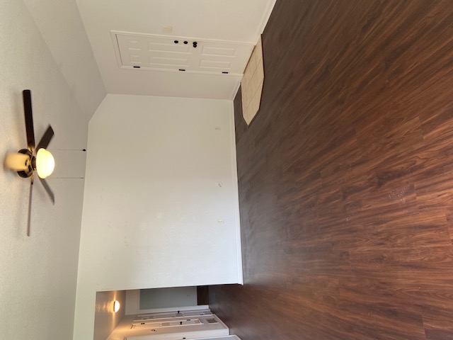 3700 Dustin Court, Unit B Killeen, TX 76549 - Photo 1 of 22 Empty room featuring dark wood-style flooring, lofted ceiling, and ceiling fan