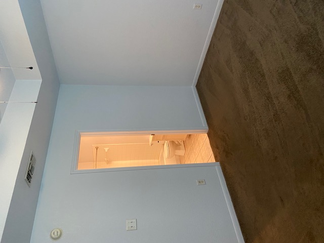 3700 Dustin Court, Unit B Killeen, TX 76549 - Photo 18 of 22 Empty room with dark carpet and baseboards