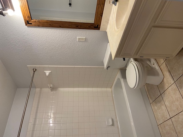 3700 Dustin Court, Unit B Killeen, TX 76549 - Photo 19 of 22 Full bath with a textured wall, vanity, bathtub / shower combination, and light tile patterned floors