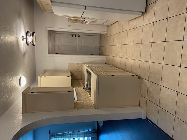 3700 Dustin Court, Unit B Killeen, TX 76549 - Photo 4 of 22 Kitchen with arched walkways, light countertops, a textured ceiling, white appliances, and tasteful backsplash