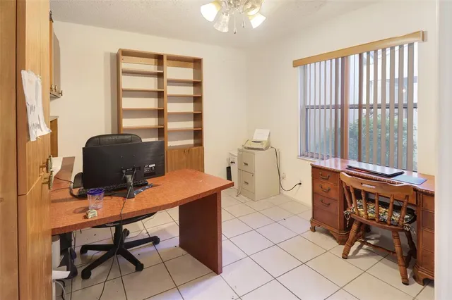 a workspace with furniture and a window