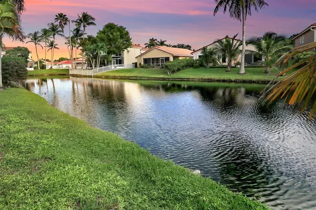 a view of a lake with a house in the background