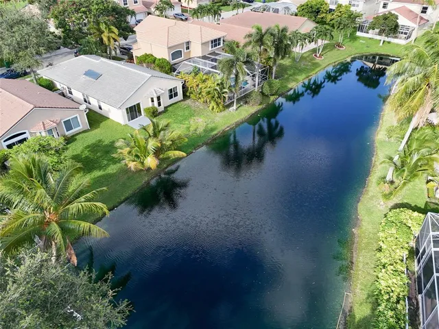 an aerial view of house with yard