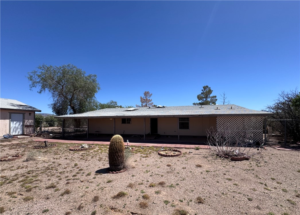 3053 McConnico Road Golden Valley, AZ 86413 - Photo 2 of 18 Back of house featuring a patio
