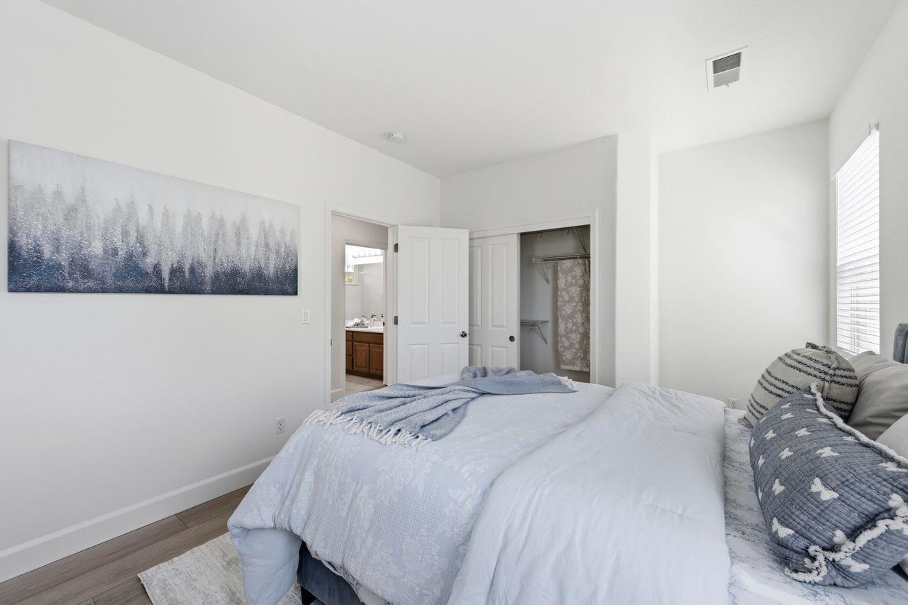 698 West Rico Way Tracy, CA 95391 - Photo 31 of 38 a bedroom with a bed and a window