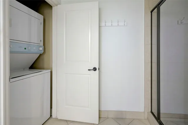 a view of storage and utility room with washer and dryer