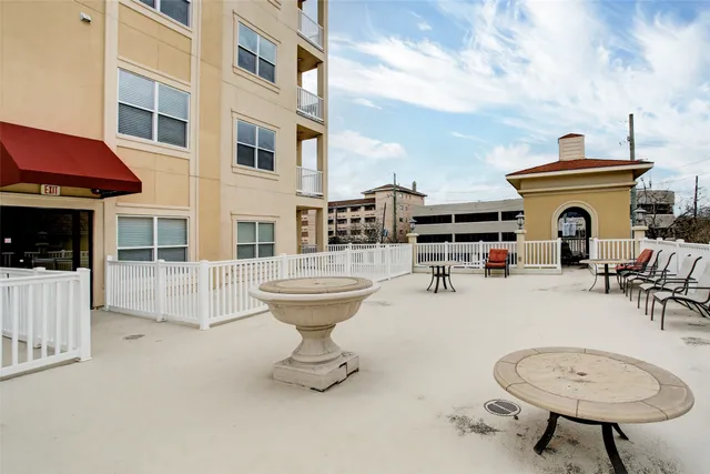 a view of roof deck with seating area