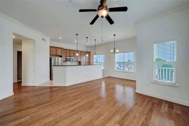 a view of a kitchen with a dishwasher cabinets and wooden floor