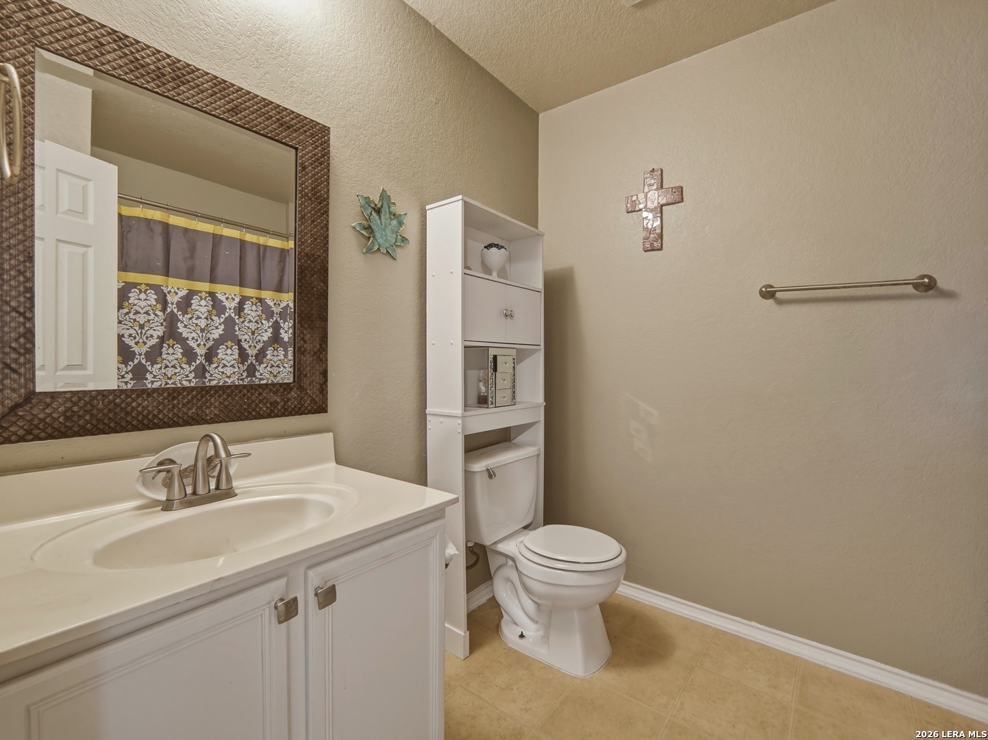 6131 Kensinger Pass Converse, TX 78109 - Photo 11 of 17 a bathroom with a sink toilet and shower