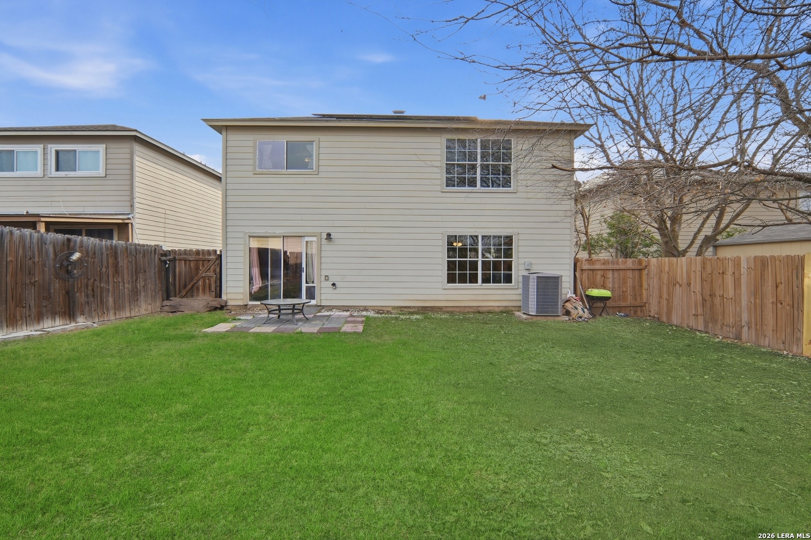 6131 Kensinger Pass Converse, TX 78109 - Photo 16 of 17 a backyard of a house with table and chairs