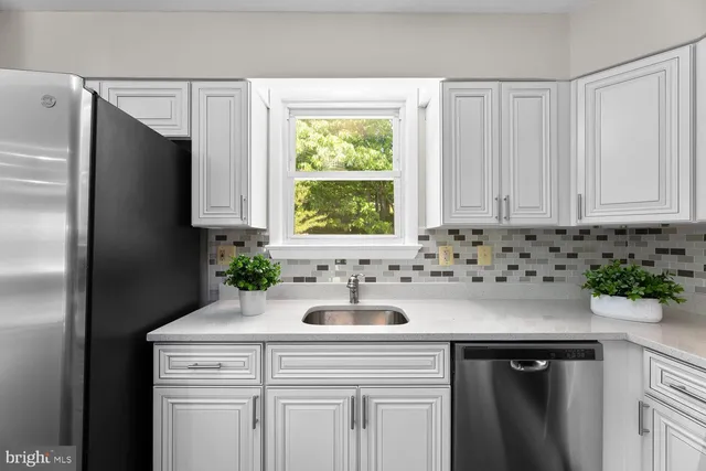 a kitchen with a sink and cabinets