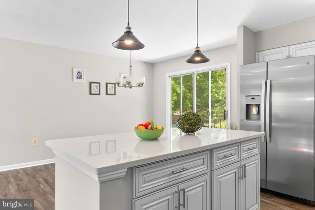 a kitchen with a refrigerator and countertop