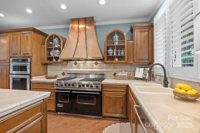 a kitchen with a stove and a sink