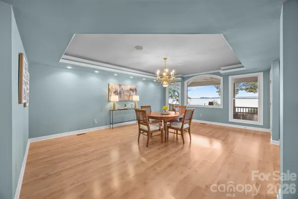 a view of a livingroom with furniture window and wooden floor