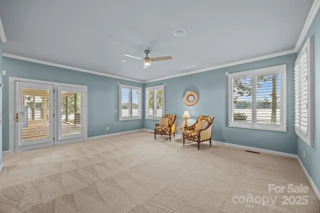 a view of a livingroom with furniture and windows