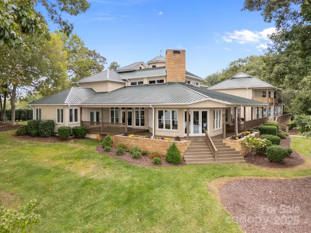 a front view of a house with a yard table and chairs