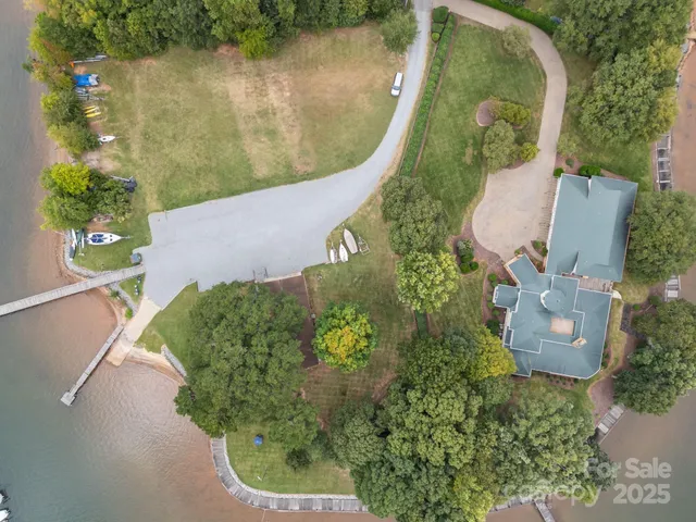 a aerial view of a house with a lake view