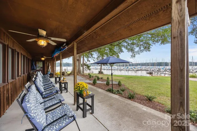 a view of a swimming pool with a couches in a patio