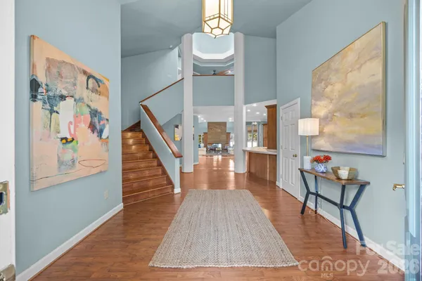 a living room with furniture wooden floor and a fireplace
