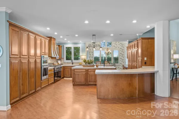 a living room with fireplace furniture and a large window