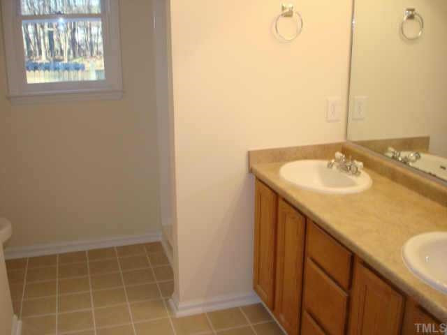 1205 Martin Pond Road Wendell, NC 27591 - Photo 5 of 10 Master bath with new countertops, sinks, toilet and real tile floor Other