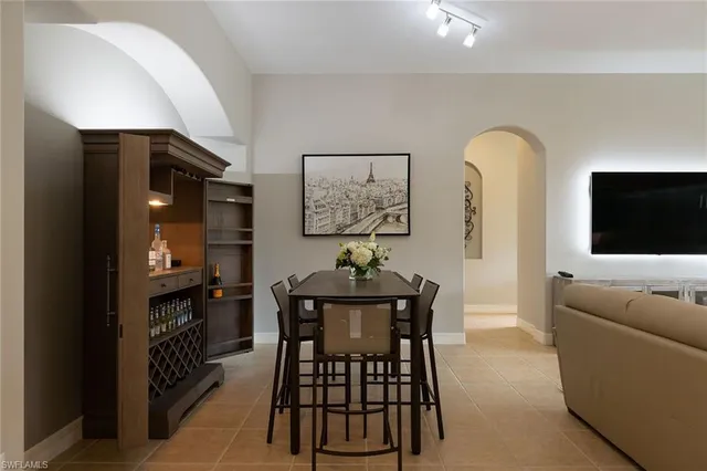 a dining room with furniture and window