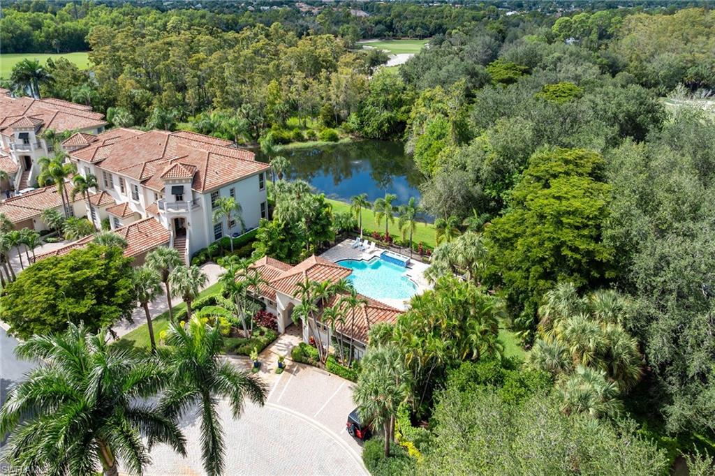 17066 Porta Vecchio Way, Unit 101 Naples, FL 34110 - Photo 31 of 32 an aerial view of residential house with outdoor space and trees all around