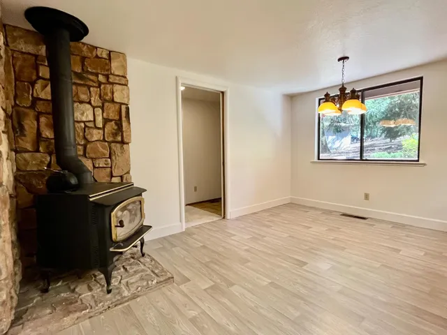 a view of an entryway with wooden floor
