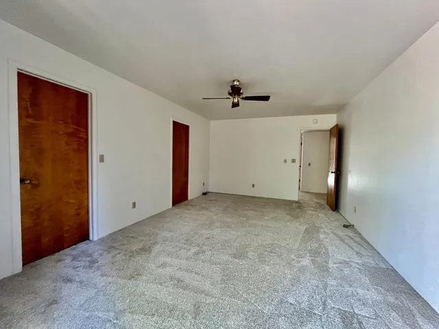a view of a livingroom with a ceiling fan