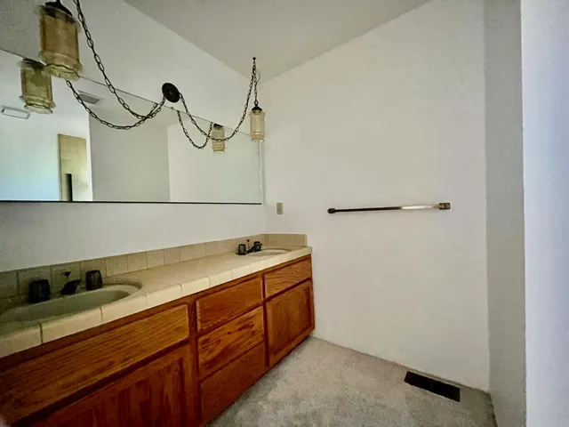 a bathroom with a sink and mirror