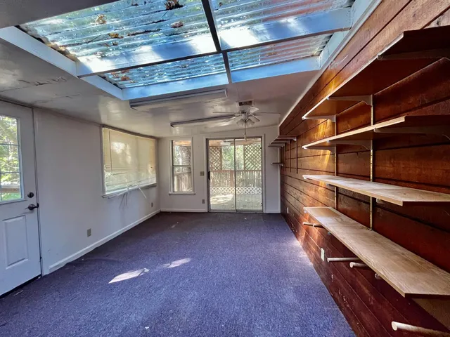 a view of an empty room with a window