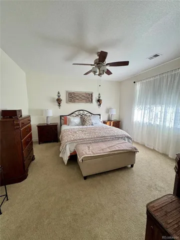 a bedroom with a bed and dresser