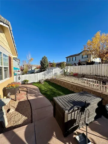 a balcony with table and chairs